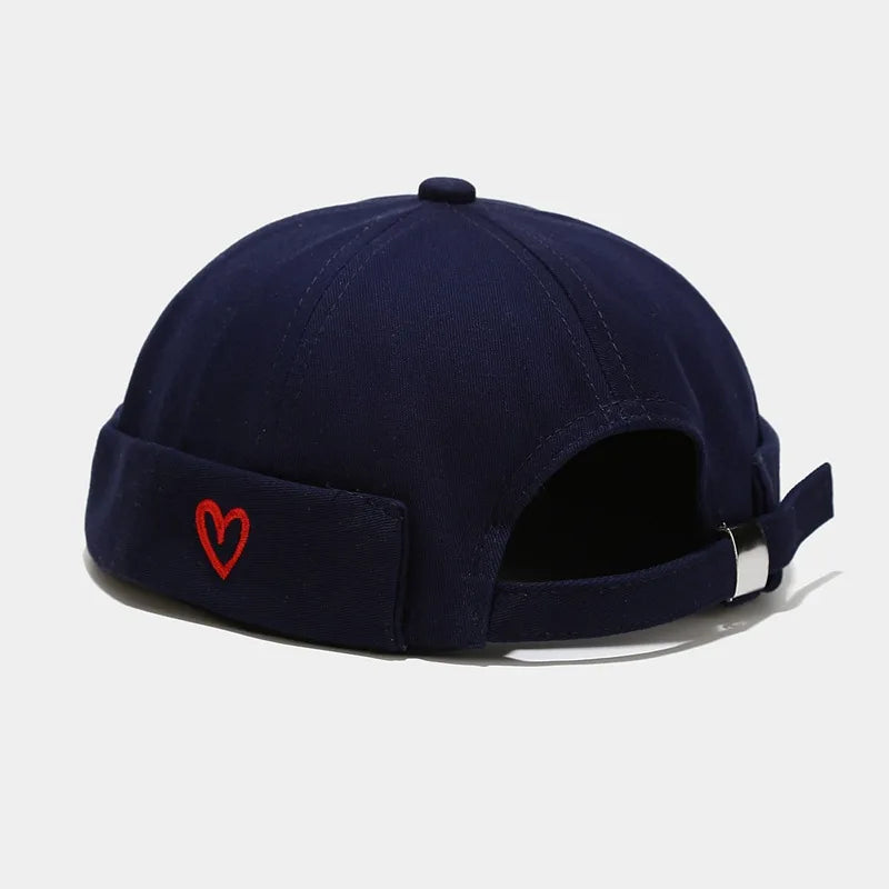 Navy blue hip hop blue landlord hat docker made of washed cotton with red heart embroidery and silver buckle back view