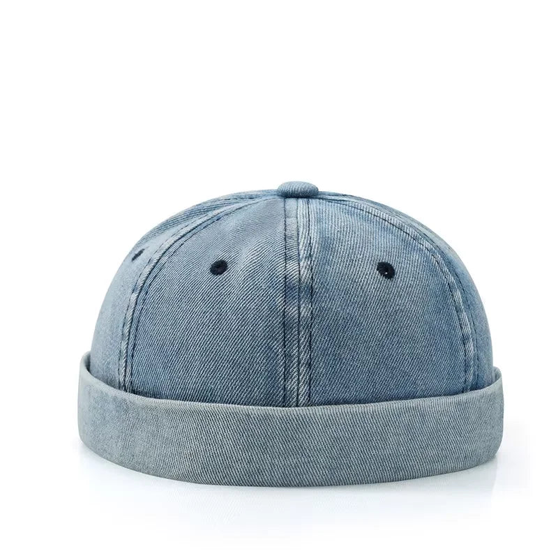 Light blue hip hop blue denim bucket hat with rolled edge brimless sailor style and black eyelets in washed cotton landlord design