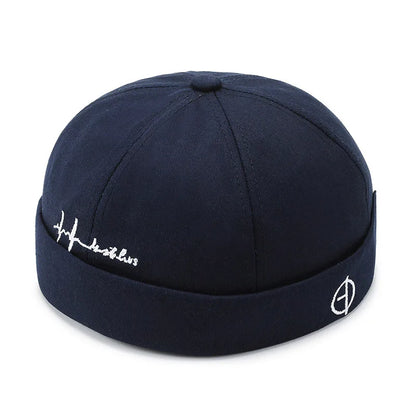 Dark navy blue hip hop blue landlord hat docker cap made of washed cotton with rolled edge brimless design and white embroidery