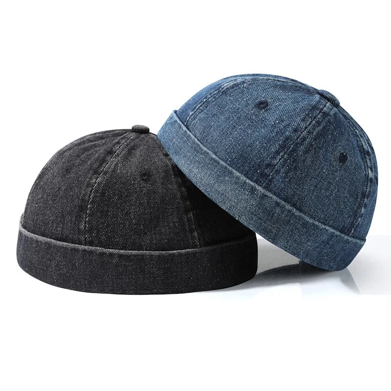 Two denim bucket hats in dark gray and medium blue featuring washed cotton landlord fabric and edge brimless sailor style