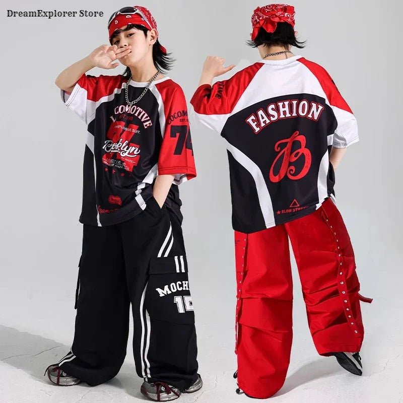 Back view of a red and black graphic hip hop boys contrast t-shirt with white accents for kids jazz costumes and red vest cargo pants sets