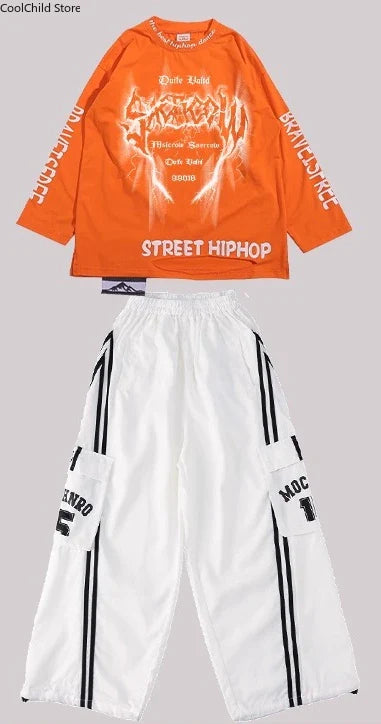 Orange long-sleeved hip hop boys t-shirt with flame graphic paired with white boys cool graffiti dance cargo pants