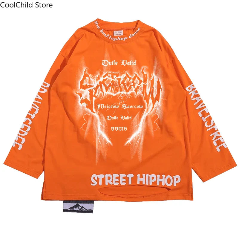 Bright orange long-sleeved hip hop boys t-shirt with white graffiti print paired with dance cargo pants for streetwear