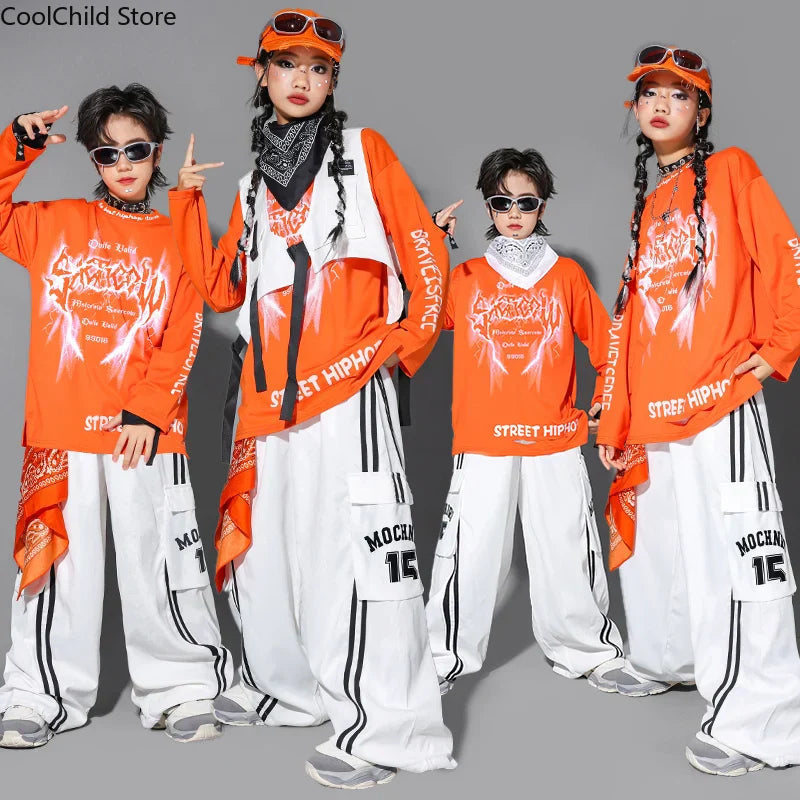 Orange street hip hop boys long sleeve shirt with flame graphic and black text paired with dance cargo pants