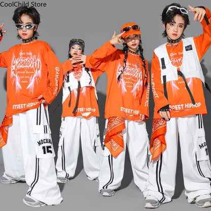 Orange street hip hop long sleeve top with white graphic print and black trim paired with boys cool graffiti dance cargo pants