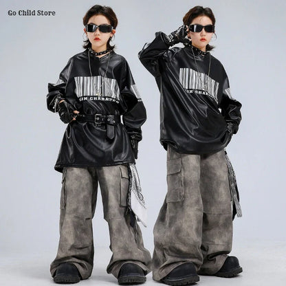 Black faux leather hip hop hoodie with bold white barcode print and in character text on the chest for kids streetwear