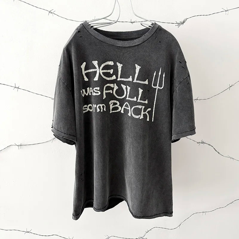 A dark gray distressed cotton oversized damaged hole t-shirt with a hip hop classic logo print vintage graphic hell was full so im back