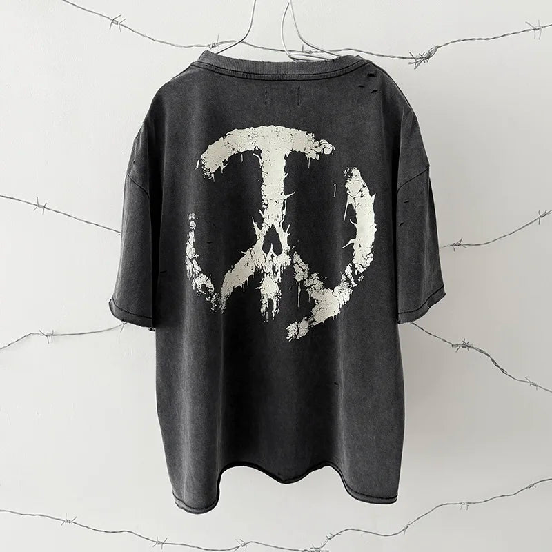Black distressed cotton hip hop classic t-shirt with oversized damaged hole and white paint-splattered peace sign skull logo print vintage design