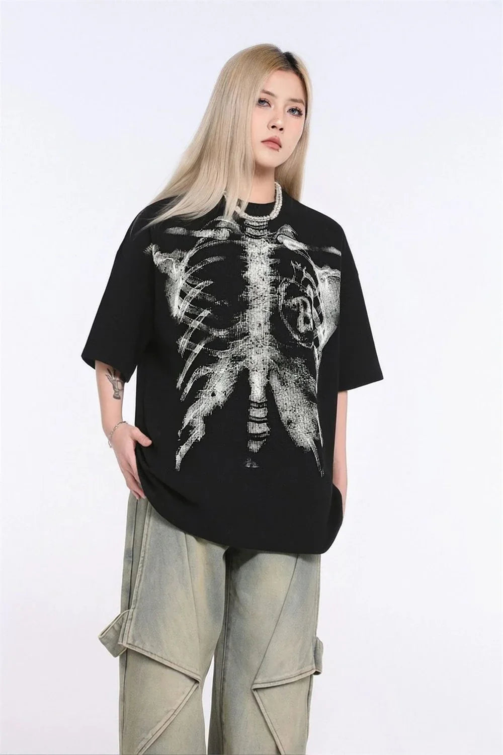 Black short-sleeved cotton t-shirt with detailed white skeletal ribcage print for hip-hop streetwear style