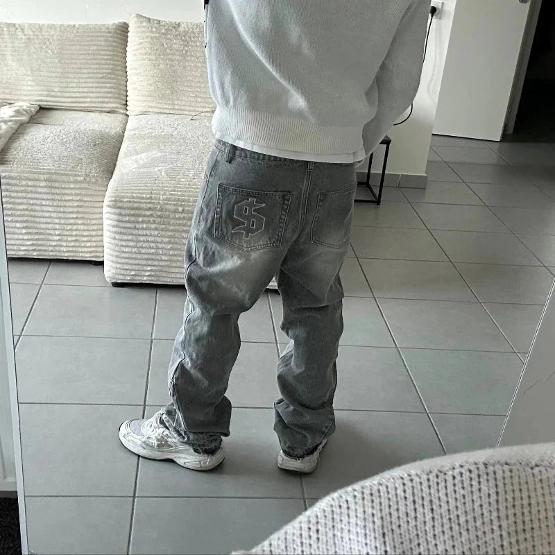 Back side of light-wash denim jeans with prominent dollar logo embroidery in embroidery streetwear unisex pcs set y2k