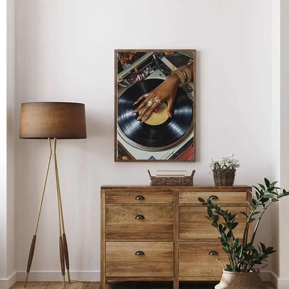 A framed art poster bar featuring a black dj hand with gold jewelry on a vinyl record for hip hop fashion decor