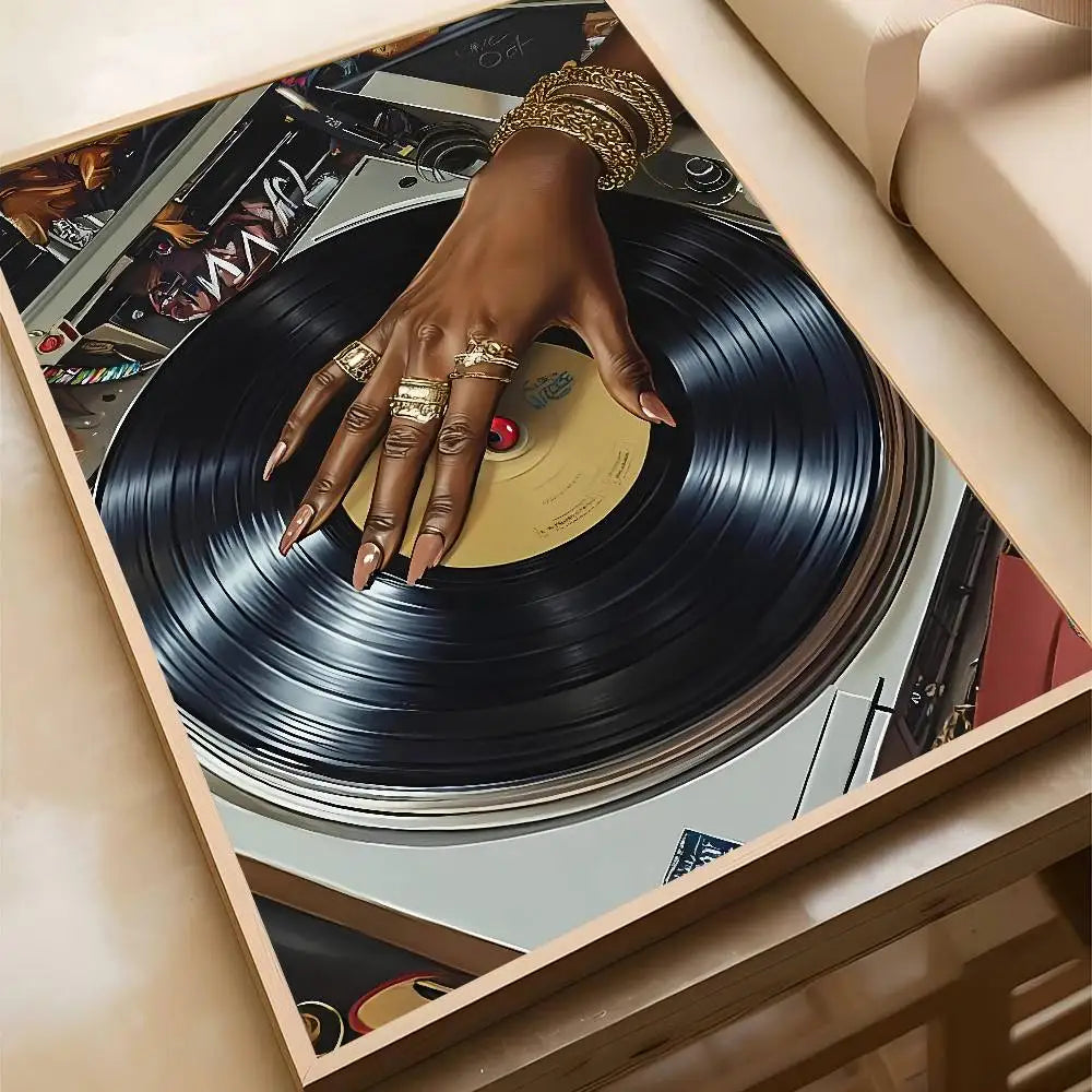 Framed art poster bar showing a black dj hand with gold rings on a spinning vinyl record for hip hop fashion decor