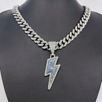 A sparkling silver lightning bolt pendant necklace with purple cz zircon on a 20inch iced out miami cuban chain