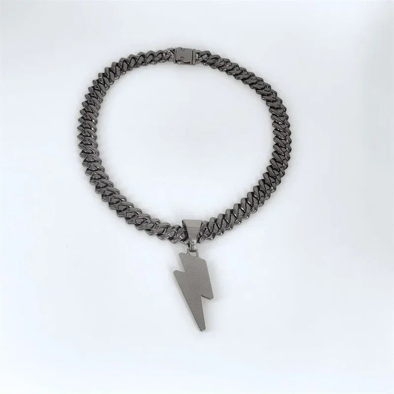 A sleek dark gray stainless steel miami cuban chain necklace with a bold zircon lightning pendant for party wear