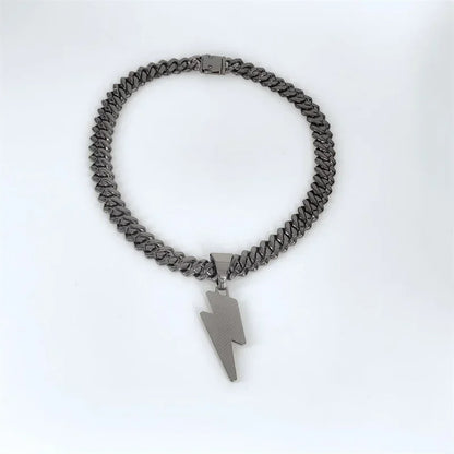 A sleek dark gray stainless steel miami cuban chain necklace with a bold zircon lightning pendant for party wear