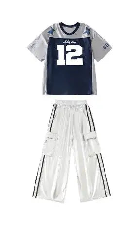 Navy blue and gray hip hop girls athletic jersey with white number 12 paired with shiny silver cargo pants for cool street dance