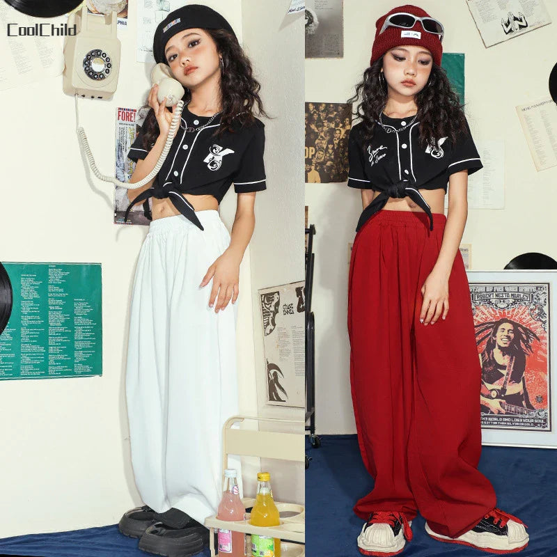Black cropped baseball style top with white piping front buttons and tie front design for hip hop street dance wear