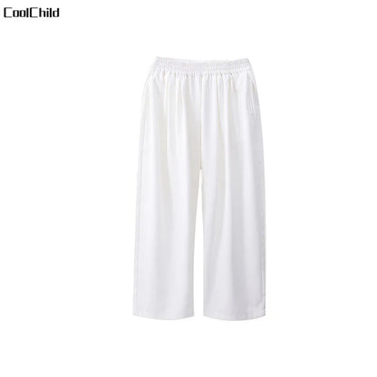 White coolchild cropped pants with elastic waistband and smooth flowing fabric for kids hip hop street dance wear