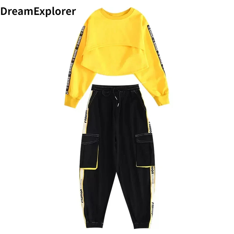 Bright yellow hip hop girls cropped sweatshirt with black text stripes paired with black contrast street dance joggers kids streetwear
