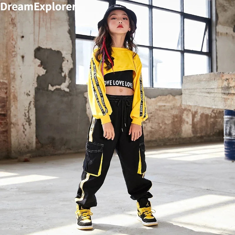 Yellow and black hip hop girls crop top and contrast street dance joggers kids streetwear with bold graphic lettering