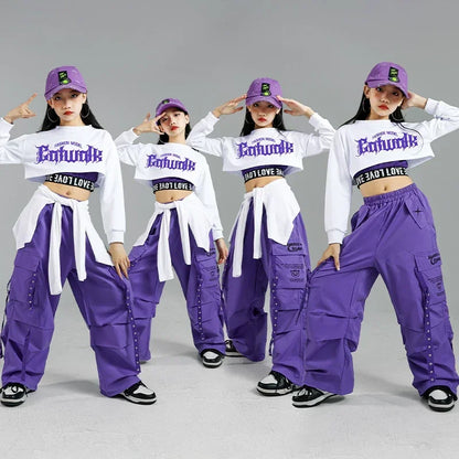 Purple cargo pants with multiple pockets and silver studs paired with white enthumble crop top for kids streetwear group