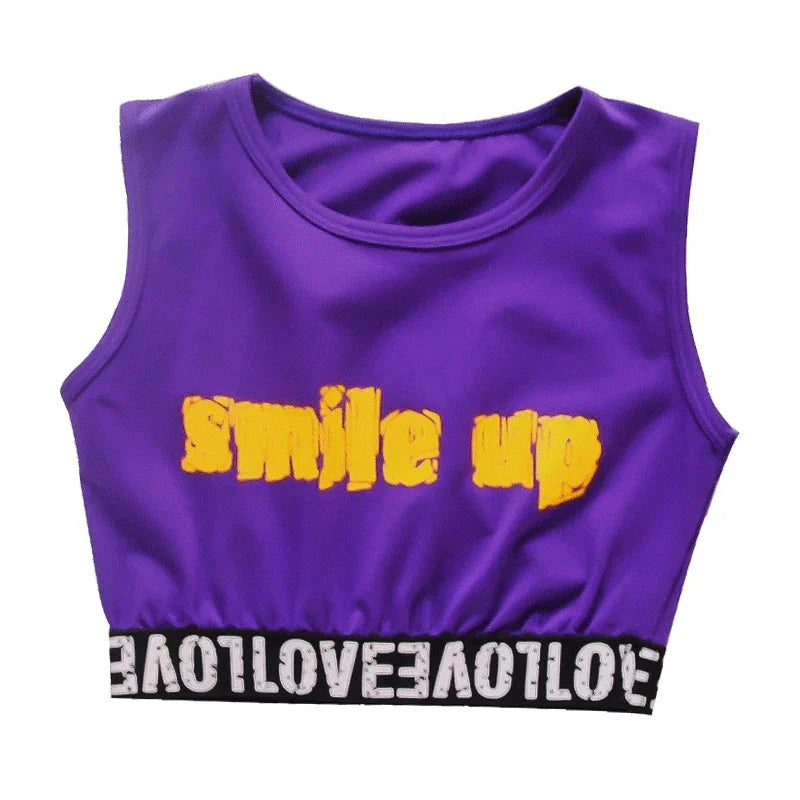 Purple sleeveless crop top with yellow smile up lettering and black waistband in kids streetwear group for children street dance