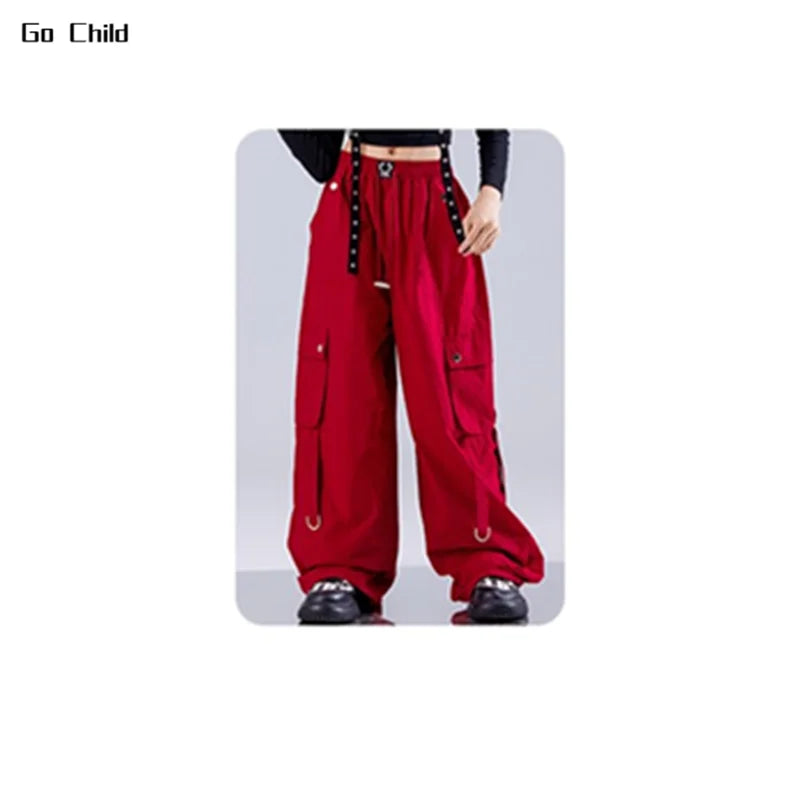 Red hip hop girls street dance cargo pants with black studded straps and silver metal accents for jazz girl group fashion