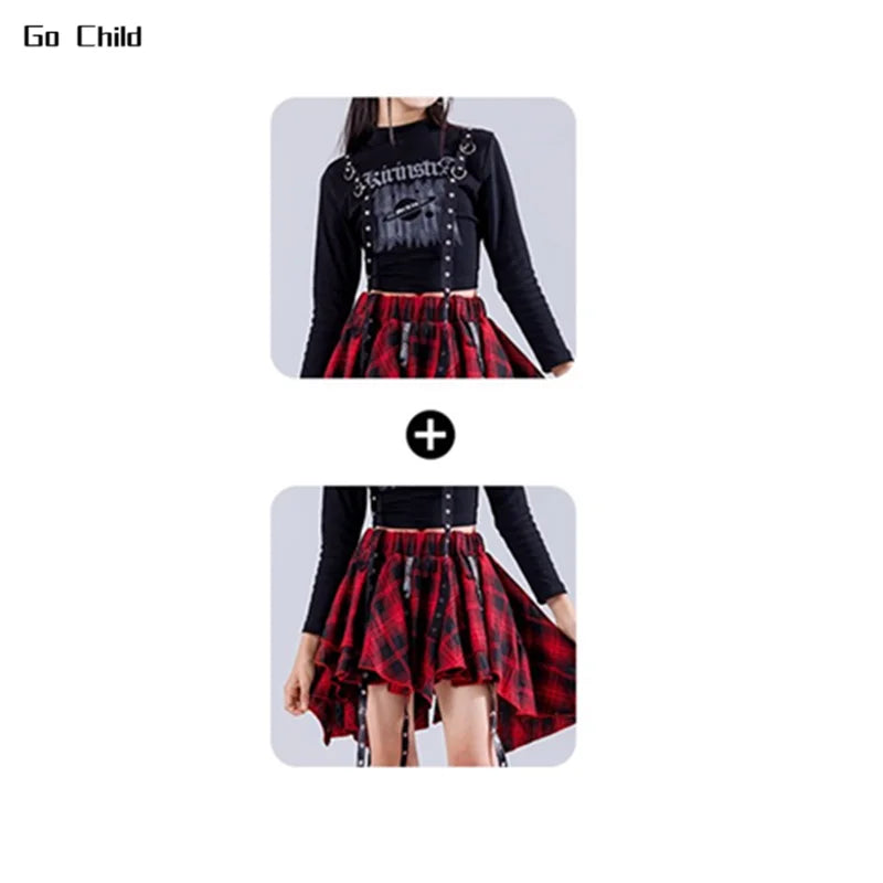 Black long-sleeved hip hop girls crop top with silver chains and studded accents paired with plaid high-low skirt for jazz girl group street dance cargo look