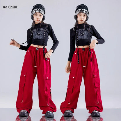 Red hip hop girls street dance cargo pants with multiple pockets and black studded straps for jazz girl group looks