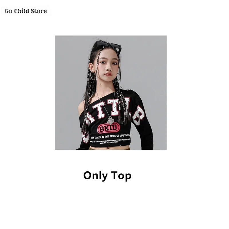 Black long-sleeved one-shoulder crop top with white red lettering and pink bkid logo for girl group streetwear and street dance clothes