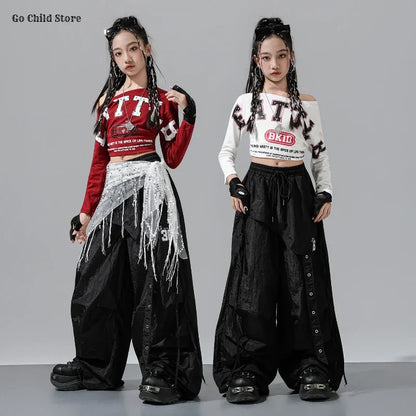Black wide-leg cargo pants kids with side button details and drawstring waistband for street dance clothes and girl group streetwear