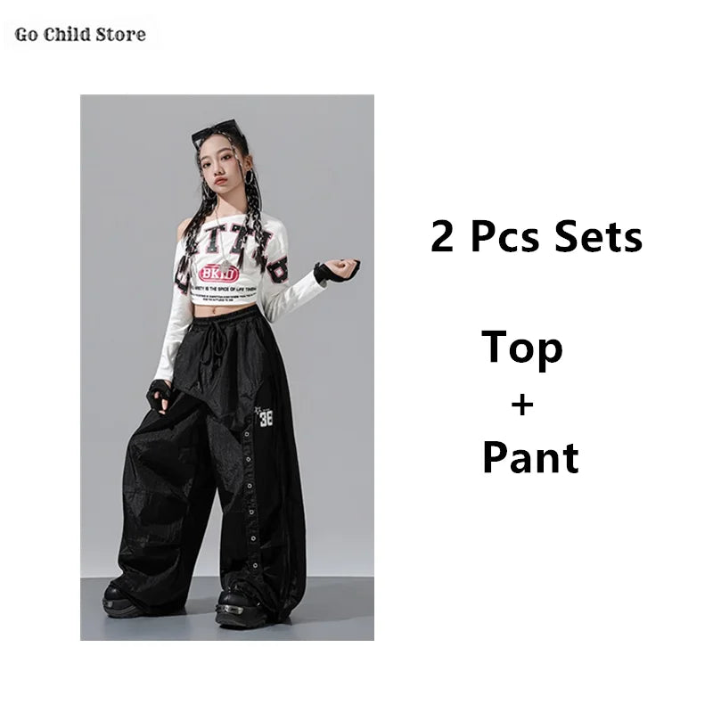 Black wide-leg cargo pants kids with drawstring waist and button details in girl group streetwear for street dance clothes