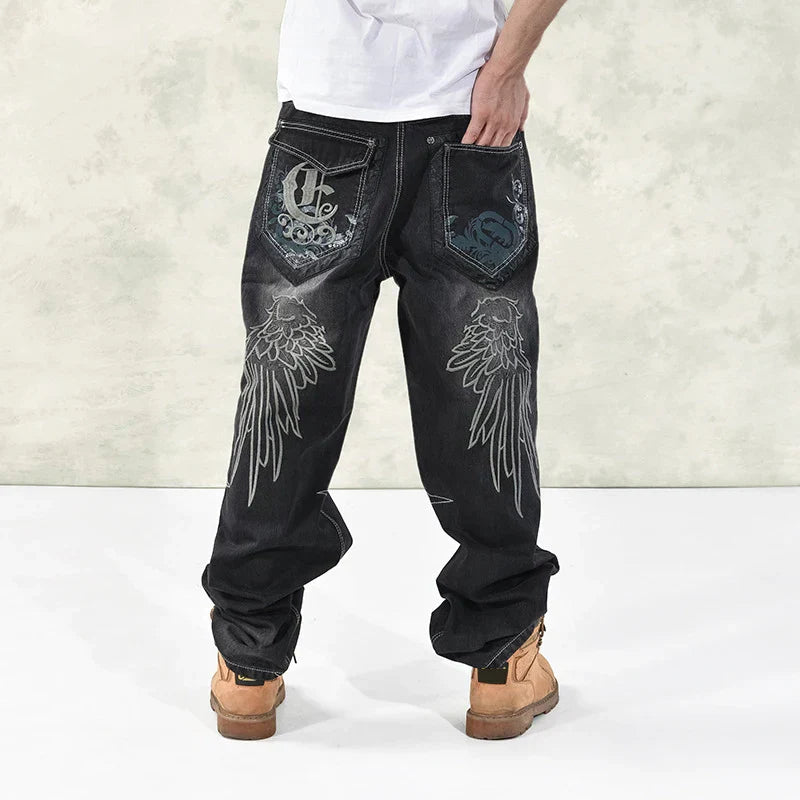 Black denim hip hop graphics embroidered jeans with silver wing embroidery and ornate back pockets for skateboard pants streetwear