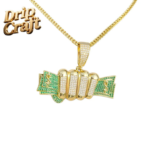 Gold-colored ice cube dollar pendant necklace with green and clear zircon accents in a trendy jewelry type beat design