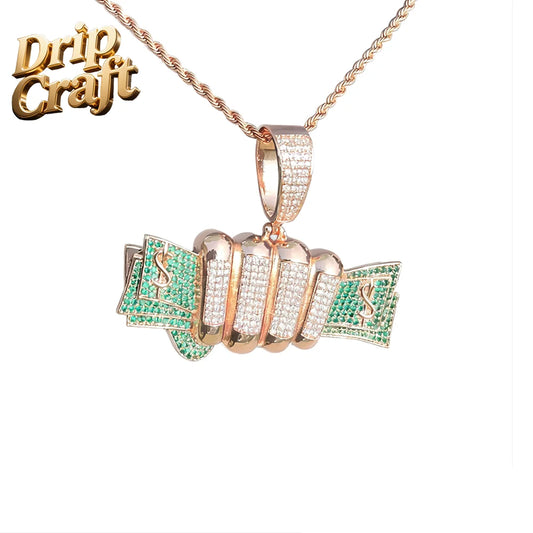 Rose gold diamond-encrusted dollar pendant with green and clear gemstone accents in trendy hip-hop jewelry style