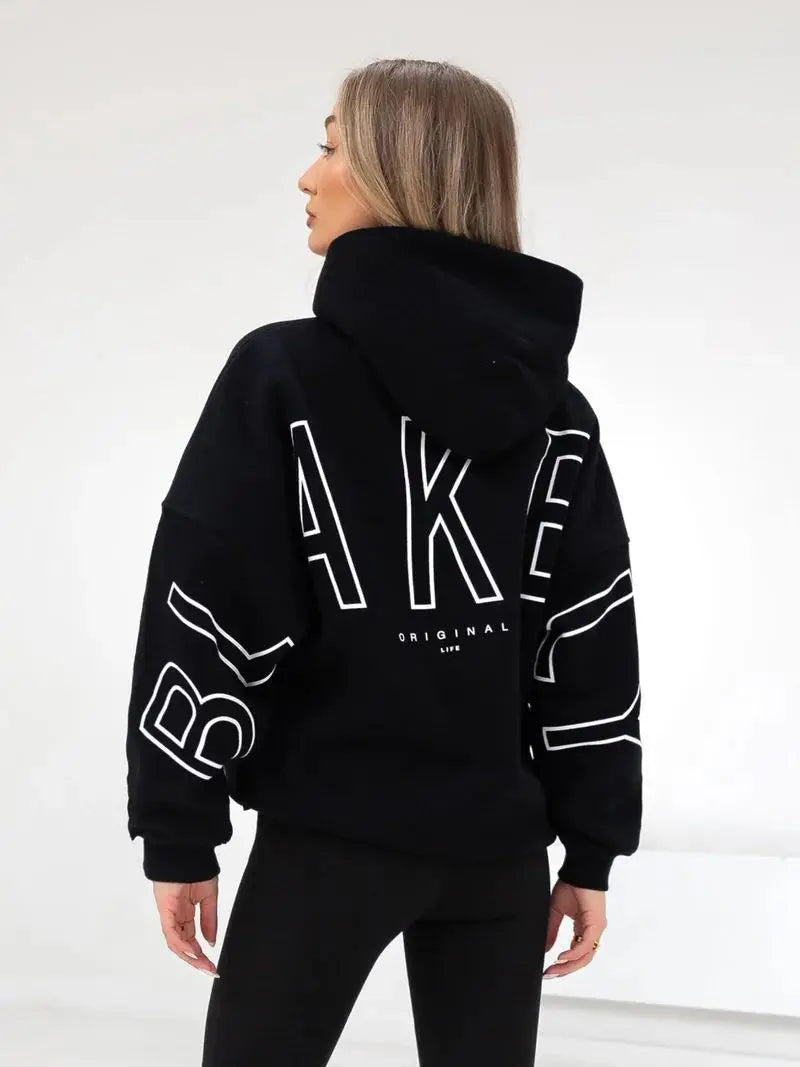 Back side of black hoodie men y2k with bold white bake lettering high collar relaxed fit harajuku high street style