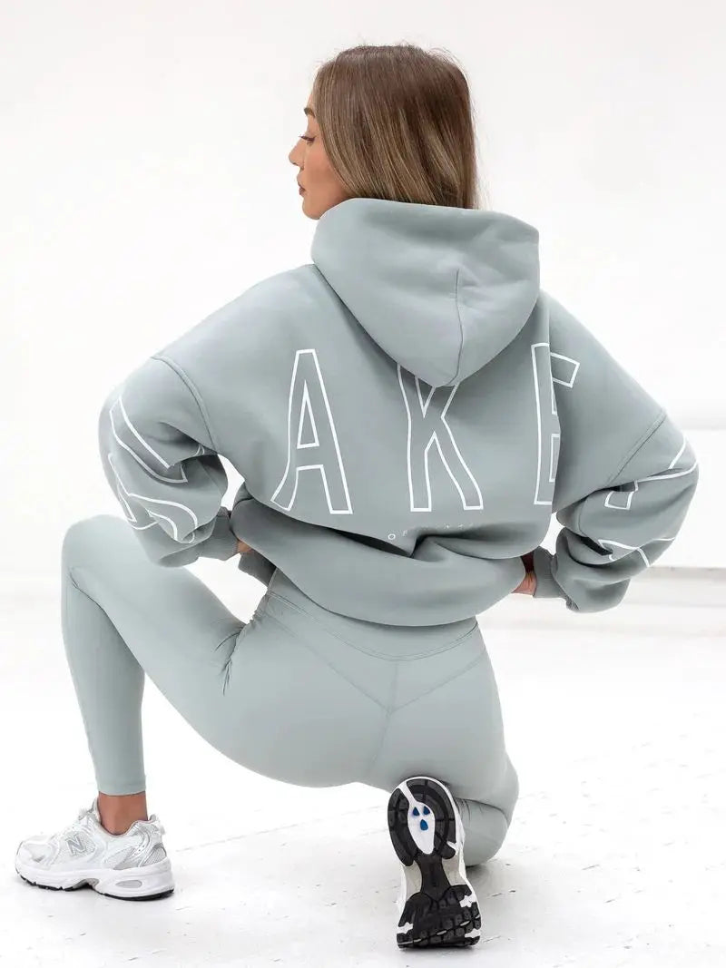 Light gray oversized hoodie men y2k with white outlined lettering on the back in harajuku high street retro gothic punk style