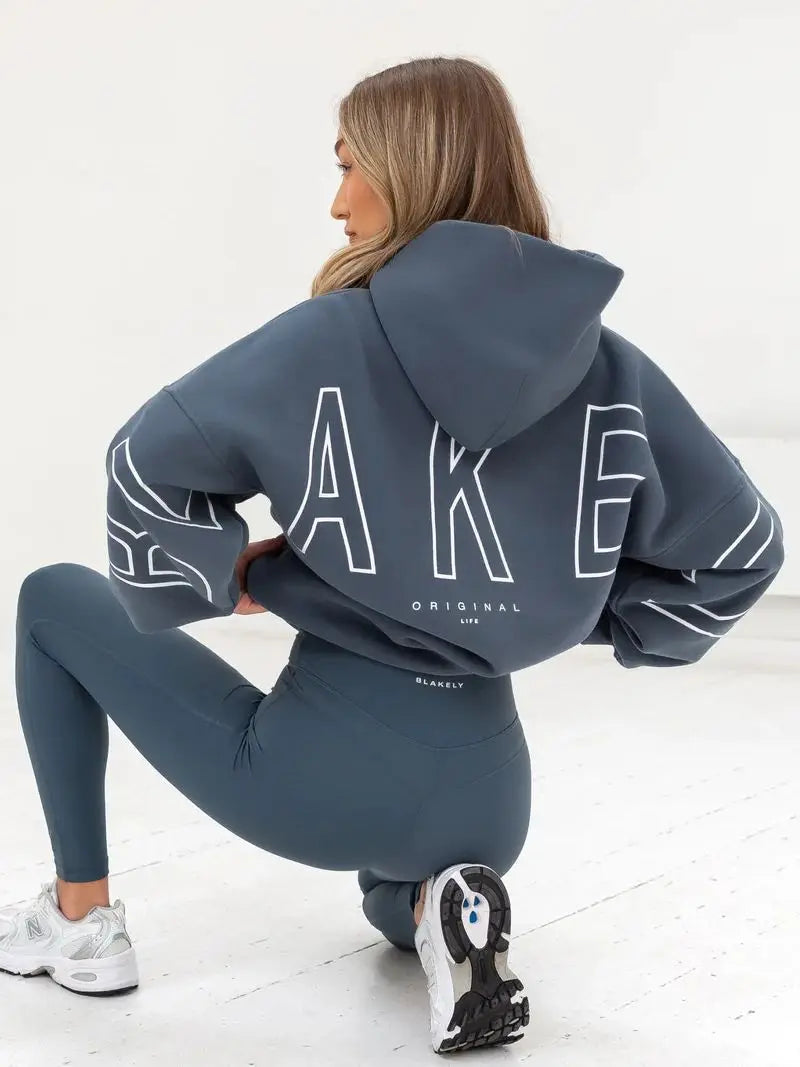 Dark gray oversized hoodie men y2k with bold white outlined lettering on back and matching sleeve harajuku high street style