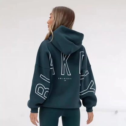Dark green oversized hoodie men y2k with bold white outlined lettering on back and sleeves harajuku high street style