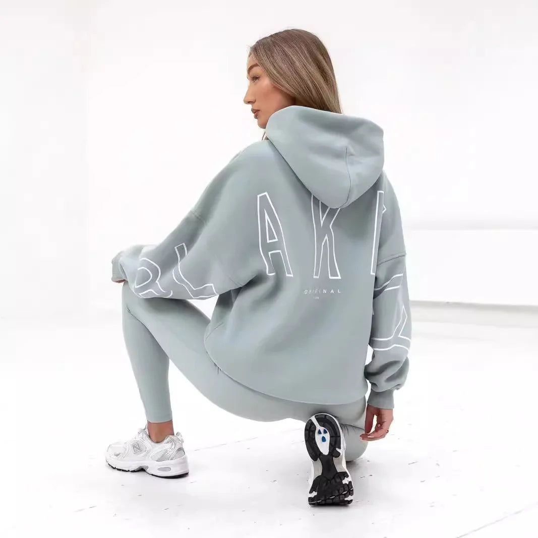 Light gray oversized hoodie men y2k with white outlined lettering on back inspired by harajuku high street retro gothic punk style
