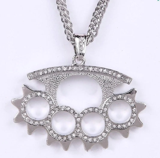 Silver-colored diamond-encrusted knuckle-duster pendant on braided chain featuring shiny cubic zirconia money bag necklace design