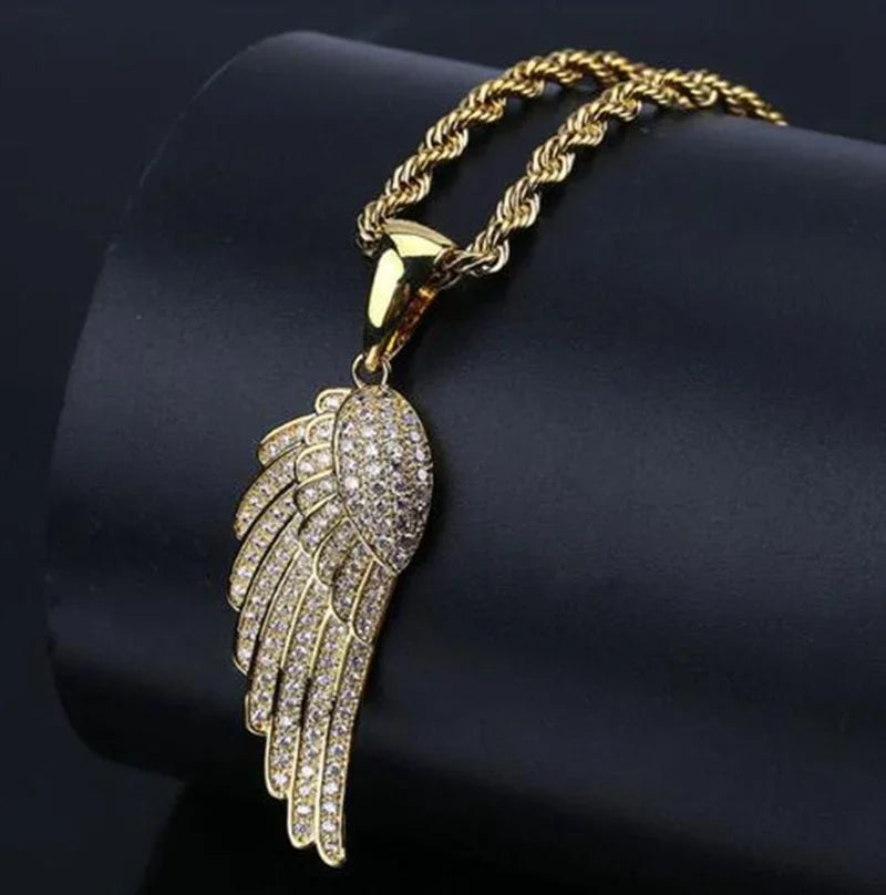 Gold-toned angel wing pendant with clear crystals on twisted rope chain combined with shiny cubic zirconia money bag necklace