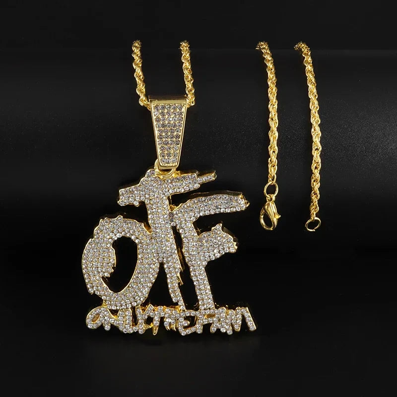Gold-colored dollar money bag necklace with shiny cubic zirconia graffiti-style of pendant and chicago engraving