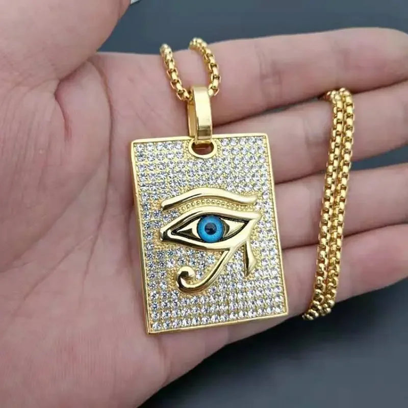 Gold-plated money bag necklace with eye of horus design, vibrant blue center, and shiny cubic zirconia crystals