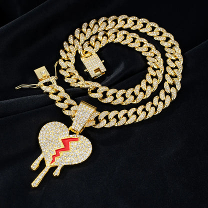 Gold-colored Miami Cuban link necklace with iced out broken heart pendants featuring red lightning bolt rapper charm jewelry