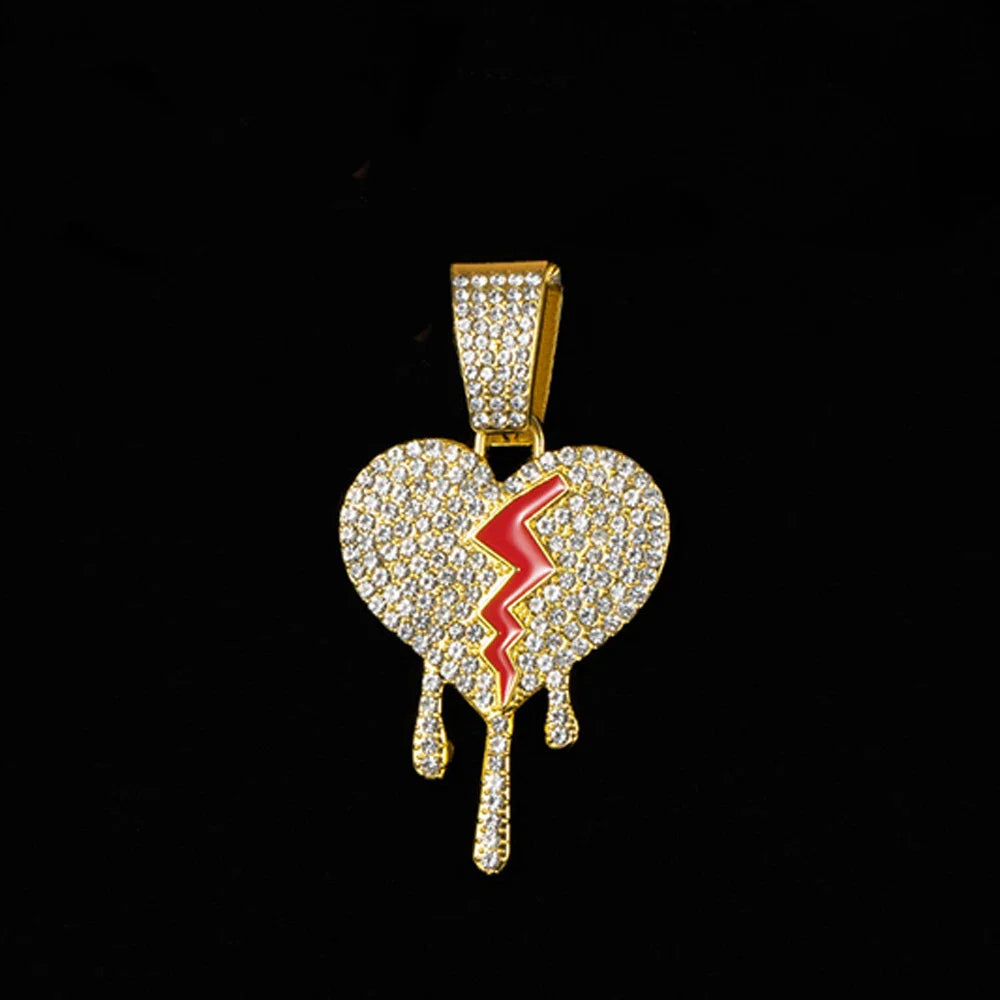Gold-colored broken heart pendant with clear crystals and red lightning bolt on miami cuban link rapper charm jewelry