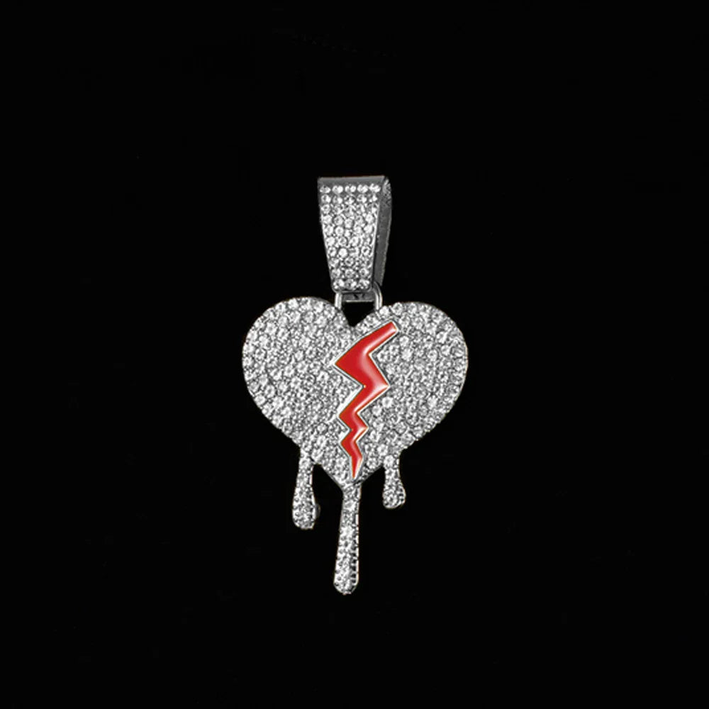 Silver heart-shaped broken heart pendant with red lightning bolt and diamond accents on miami cuban link chain rapper charm jewelry