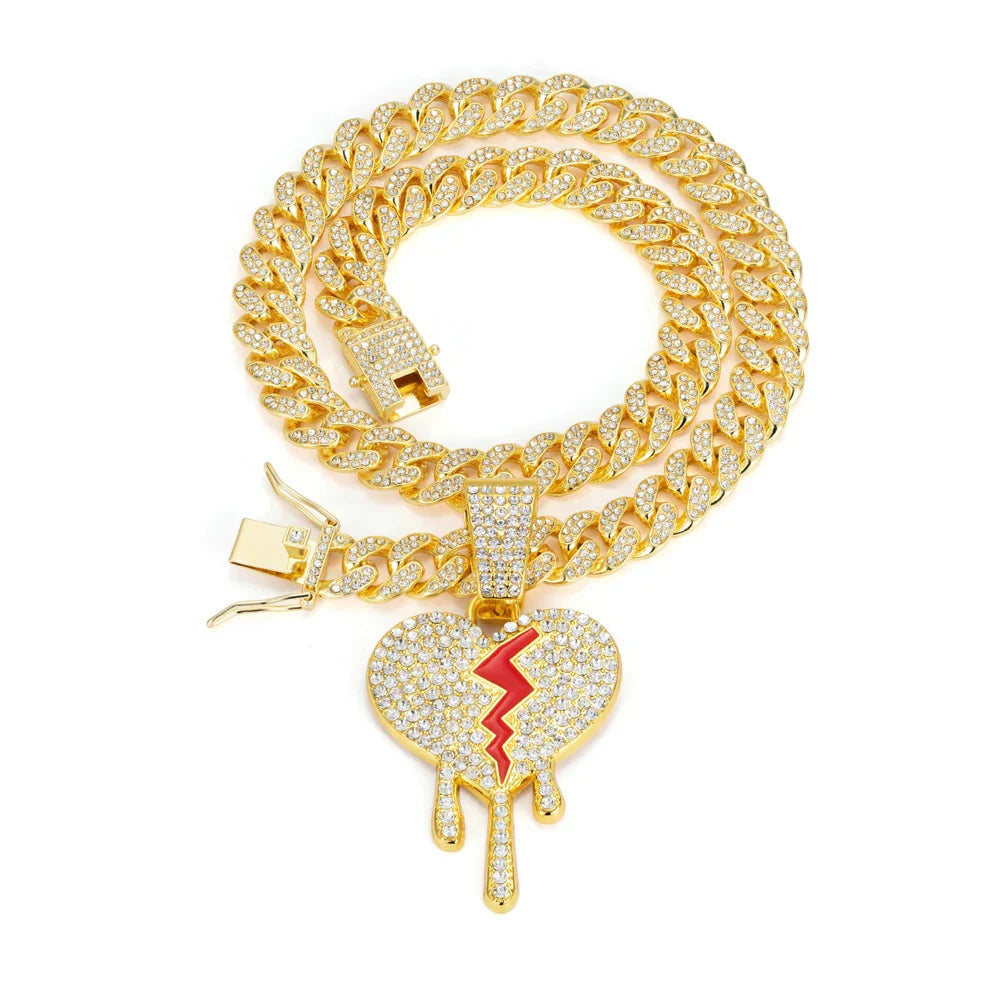 Gold-colored hip hop iced out broken heart pendant necklace with red crack design on miami cuban link chain rapper charm jewelry