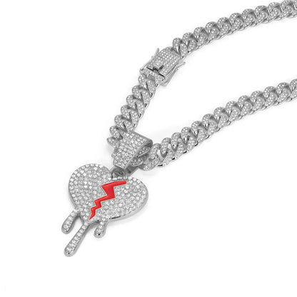 Silver miami cuban link chain necklace with iced out broken heart pendant and bold red lightning bolt rapper charm jewelry