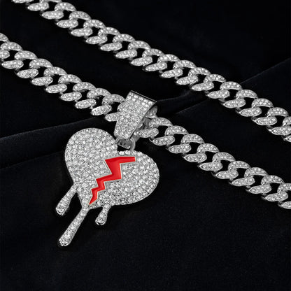 Silver iced out broken heart pendant with red enamel crack and crystals on miami cuban link necklace rapper charm jewelry